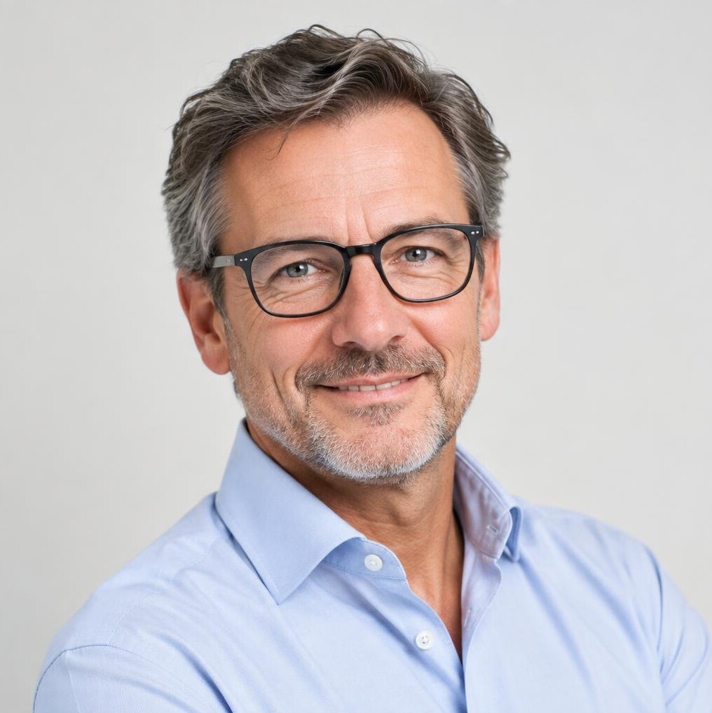 Studio portrait of a Caucasian man with glasses